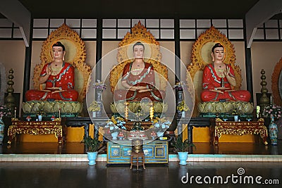 Three statues of meditating Buddha Stock Photo