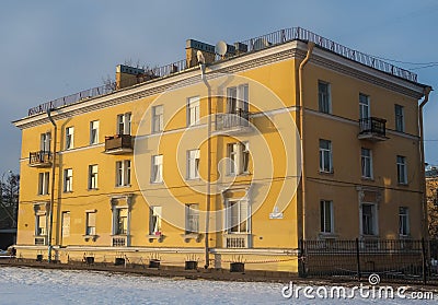 Three-story yellow residential building in the city Editorial Stock Photo