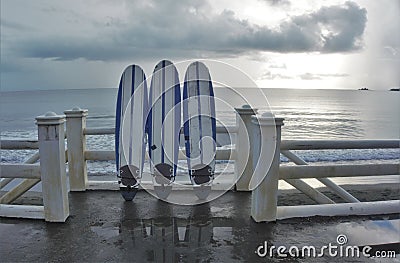 Three 3 surf boards fronting the sea Stock Photo