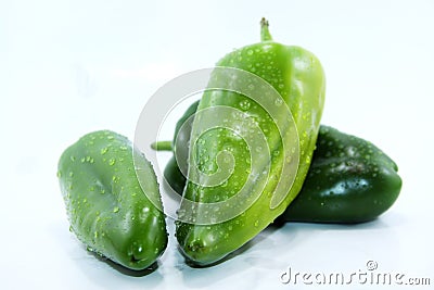 Three sweet green peppers white background Stock Photo