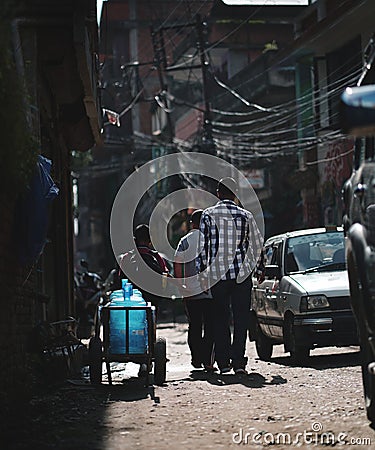 Three Teens Passing by Narrow Thamel Street Editorial Stock Photo