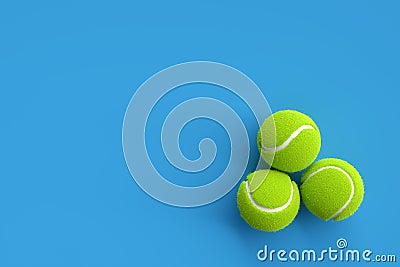 Three tennis balls on blue background with copy space. 3D rendering. Flat lay overhead view Stock Photo