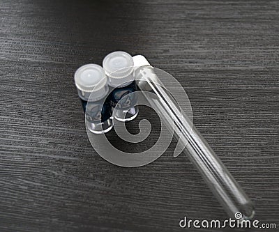 Three test flasks on a dark background Stock Photo