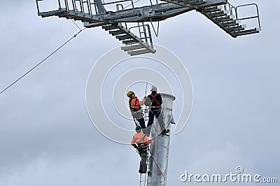 Three thumping assemblers under the helicopter Editorial Stock Photo