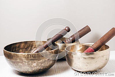 Three Tibetan bowls on the table. Stock Photo