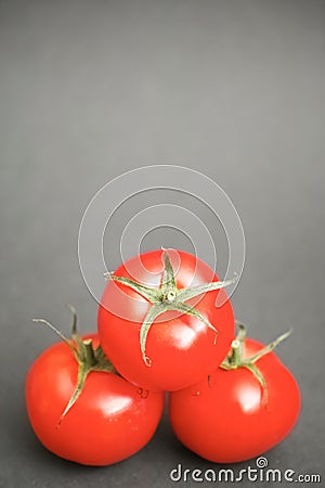 Three tomatoes Stock Photo