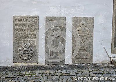 The three tombsones next to the entrance door to the Chaplain`s House, Cesky Krumlov, Czech Republic Stock Photo