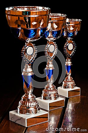 Three tournament prizes on table Stock Photo