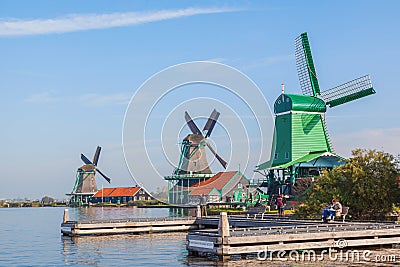 Three traditional dutch windmill beside the canal Editorial Stock Photo