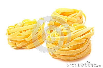 Three uncooked pasta nests Stock Photo