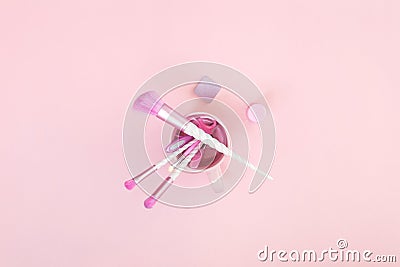 Three unicorn makeup brushes on silver pink Stock Photo