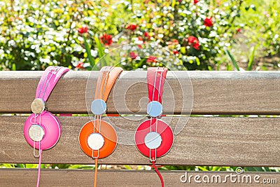 Three varicolored headphones of different colors Stock Photo