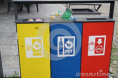 Three waste separation bins for paper, plastic and aluminium with inscription in Italian language and pictograms or pictures for e Editorial Stock Photo