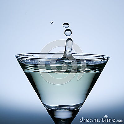 Three water drops Splash on the Champagne glass. Stock Photo