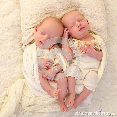 Sleeping identical twin babies Stock Photo