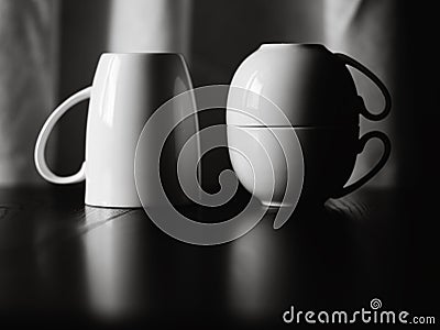 Three white cups on the table Stock Photo