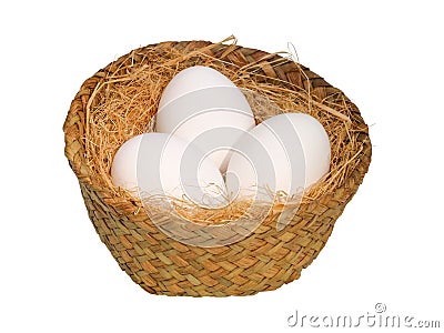 White eggs in a wicker basket isolated on white Stock Photo