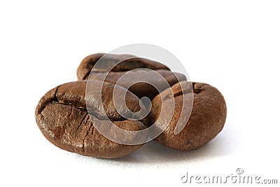 Three whole coffee beans detail Stock Photo