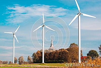 Three wind farms and church Stock Photo