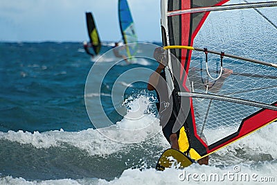 Three windsurfers in action Stock Photo