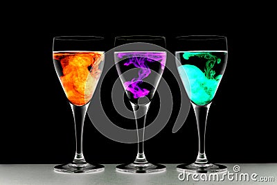 Three wine glasses with food coloring Stock Photo