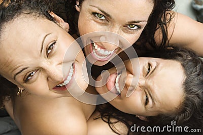 Three women embracing. Stock Photo