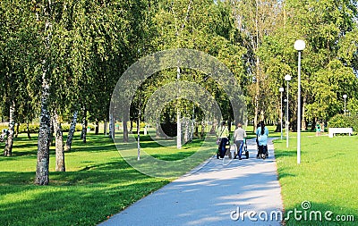 Three women in the park for a walk with the children Editorial Stock Photo