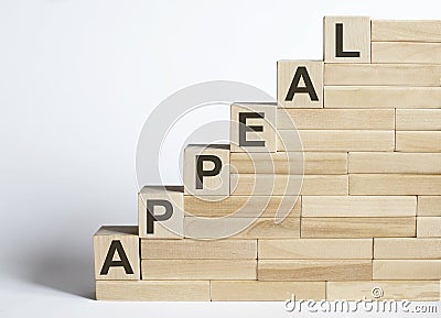 Three wooden cubes with letters APPEAL on white table Stock Photo