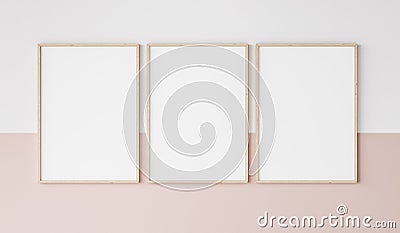 Three wooden frames on pink and white wall, frame mockup Stock Photo