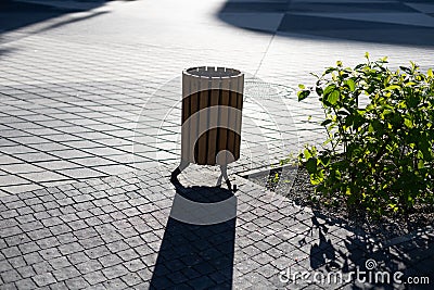 Three wooden litter bins in public area Stock Photo