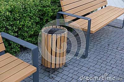 Three wooden litter bins in public area Stock Photo