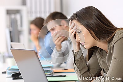 Three worried employees reading bad news on line Stock Photo