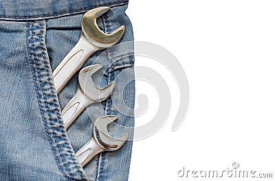 Three Wrenches in Blue Jeans Pocket Stock Photo