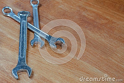 Three wrenches on wooden background master repair tool Stock Photo