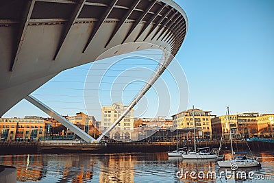 Three yachts sailing under the Millennium Bridge on River Tyne Editorial Stock Photo