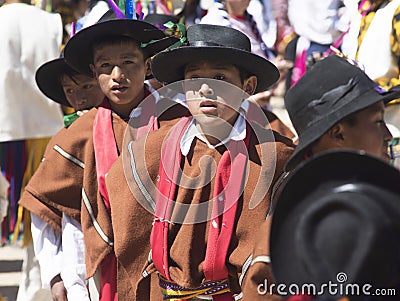 Three 10-year-old boys close-up looking straight ahead with typical clothes and indigenous hats from the city of Cusco Oct 2020 Editorial Stock Photo