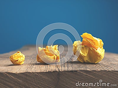 Three yellow paper balls on a table Stock Photo