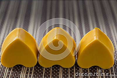 Three yellow soap hearts Stock Photo