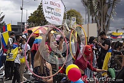 Three young female protesters making dancing art and juggling at HÃ©roes monument Editorial Stock Photo