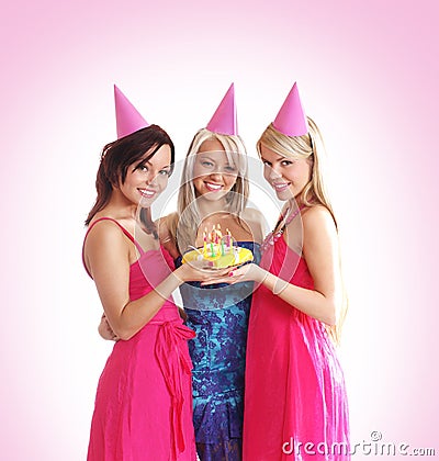 Three young girls are celebrate a birthday party Stock Photo