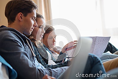 Three young students preparing for exams Stock Photo