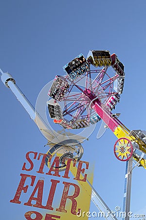 Thrill rides and top of Texas tower at Fair park Editorial Stock Photo