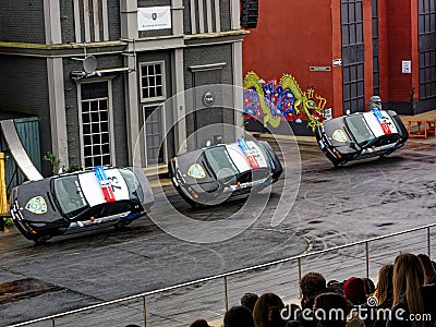 Police cars drive in tilted position at stunt show Crazy Cops in Movie Park Germany Editorial Stock Photo