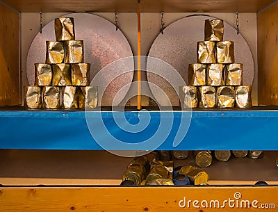 Throw a ball on a pyramid of cans Stock Photo