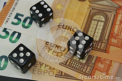 Throwable dice on 50 euro banknotes. Gambling. Stock Photo