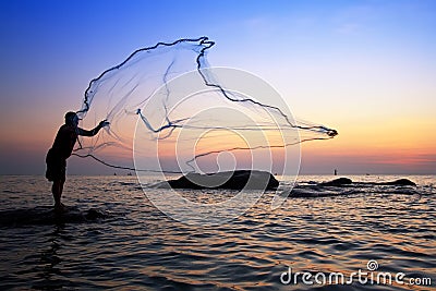 Throwing fishing net Stock Photo