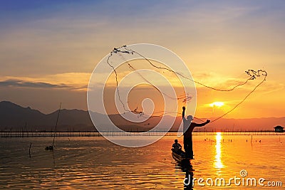 Throwing fishing net during sunset Stock Photo
