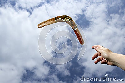 Throwing painted boomerang, midair Stock Photo