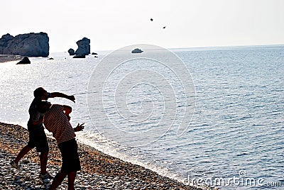 Throwing stones in the sea Stock Photo