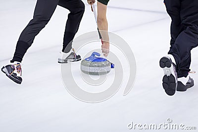 Thrown Curling Stone Stock Photo